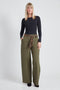Woman wearing the Ponte Tie-Sash Wide Leg Pant in Olive.