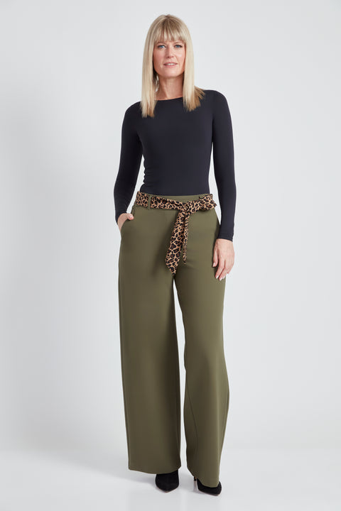 Woman wearing the Ponte Tie-Sash Wide Leg Pant in Olive.
