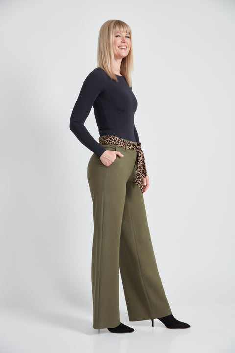 Woman wearing the Ponte Tie-Sash Wide Leg Pant in Olive, side view.