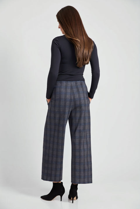 Woman wearing Ponte Ramsey plaid cropped gaucho wide-leg pants, back view