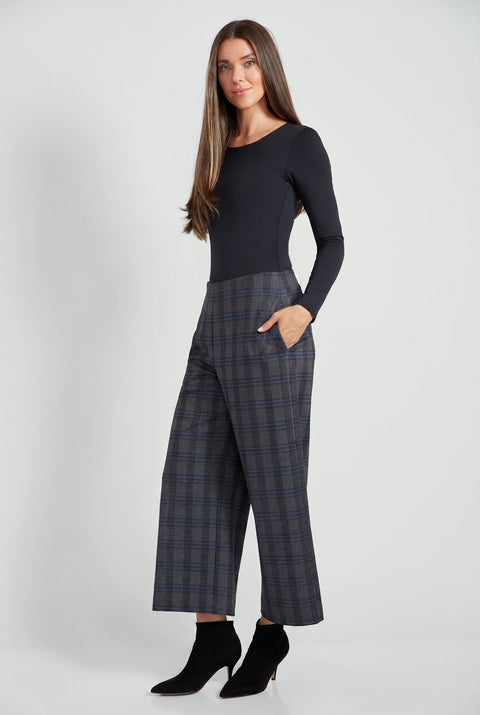 Woman wearing Ponte Ramsey plaid cropped gaucho wide-leg pants, side view