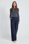Woman wearing the Precision Ponte Wide Leg Pant in Navy.