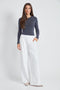 Woman wearing the Precision Ponte Wide Leg Pant in White.