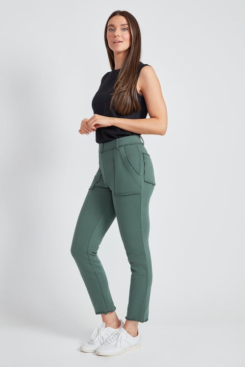 Woman wearing the French Terry Raw Edge Slim Cargo Pant in Ivy Green, side view.