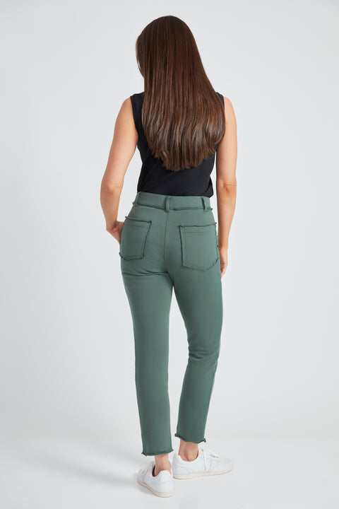 Woman wearing the French Terry Raw Edge Slim Cargo Pant in Ivy Green, back view.