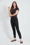 Woman wearing the Suede Petal-Vent Slim Pant in Black.