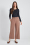 Woman wearing the Ponte Belted Gaucho Pant in Biscuit.