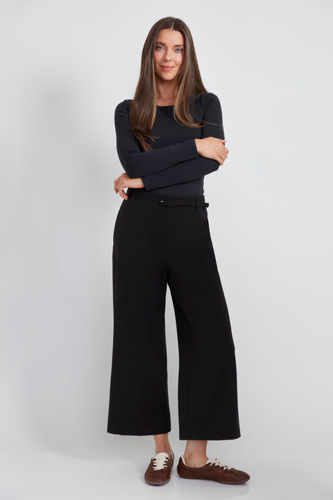 Woman wearing the Ponte Belted Gaucho Pant in Black.