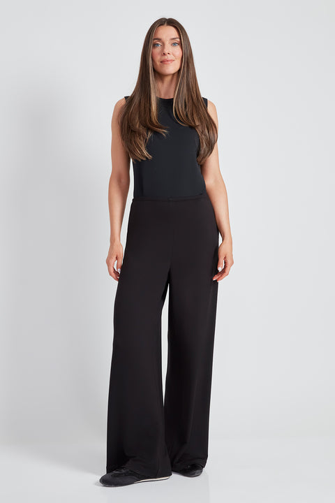 Woman wearing the Provence Wide-Leg Pant in Black.
