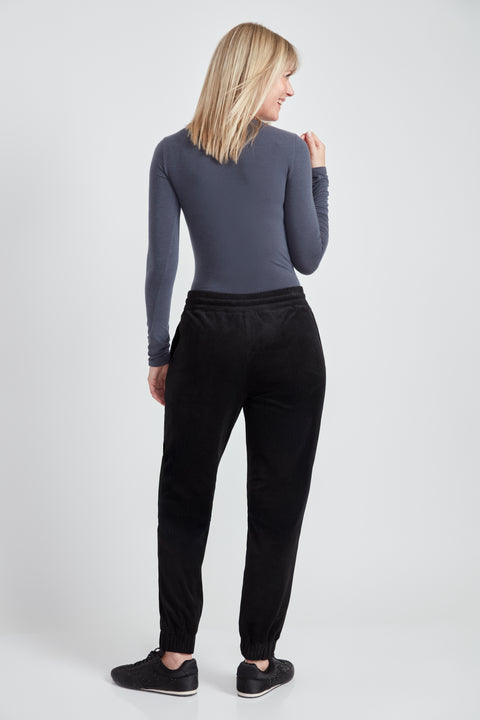 Woman wearing the Knit Corduroy Jogger in Black, back view.