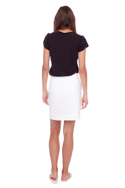 Back view of model wearing UP! Techno Core Petal Slit Skort in White.