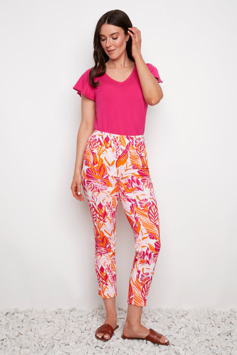 Model wearing UP! Sunset Techno Petal-Slit Ankle Pant in Sunset print, front view.