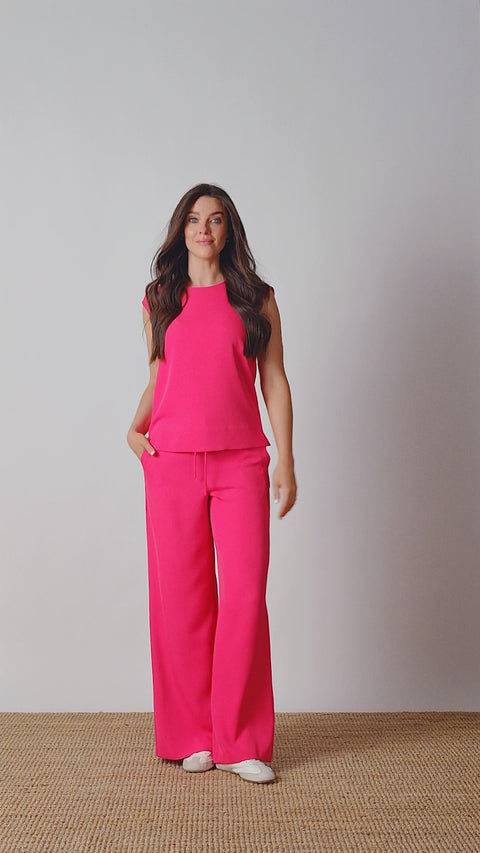 Video of model wearing UP! Vegan Silk Wide-Leg Full-Length Pant in Dahlia with tie-front ruched waist detail.