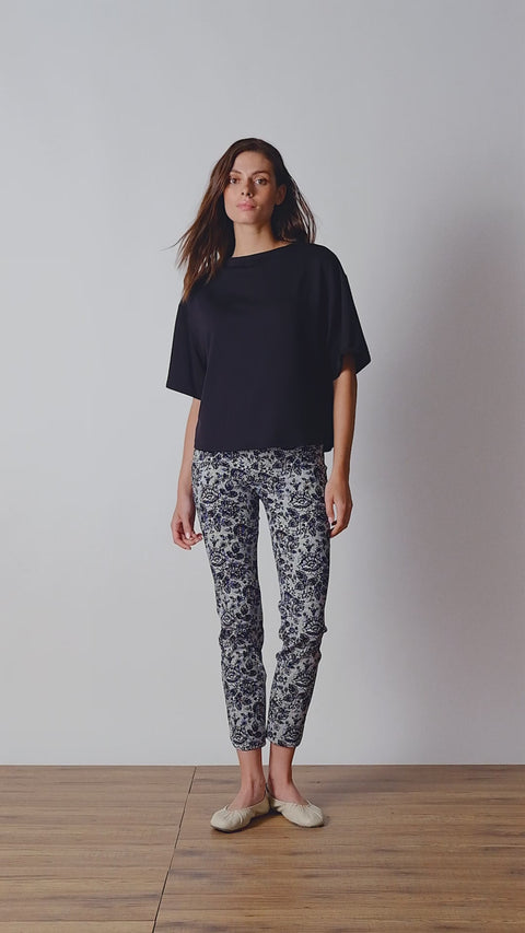 Video of model wearing UP! Lacey Techno Petal-Slit Ankle Pant in Lacey print with petal vent detail.