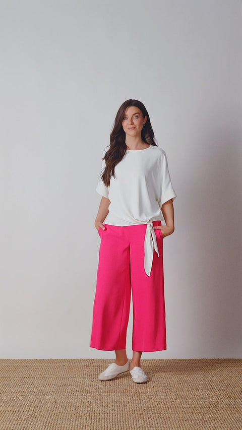 Video of model wearing UP! Vegan Silk Wide Leg Cropped Pant in Dahlia Red