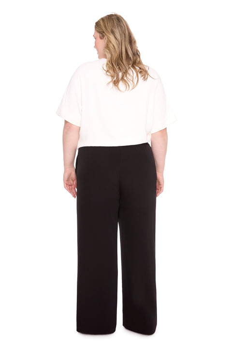 Model wearing vegan silk 261101_WideLeg_Black_Back, sizes 1X–3X.