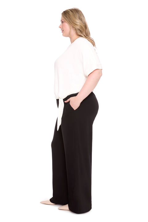 Model wearing vegan silk 261101_WideLeg_Black_Side, sizes 1X–3X.