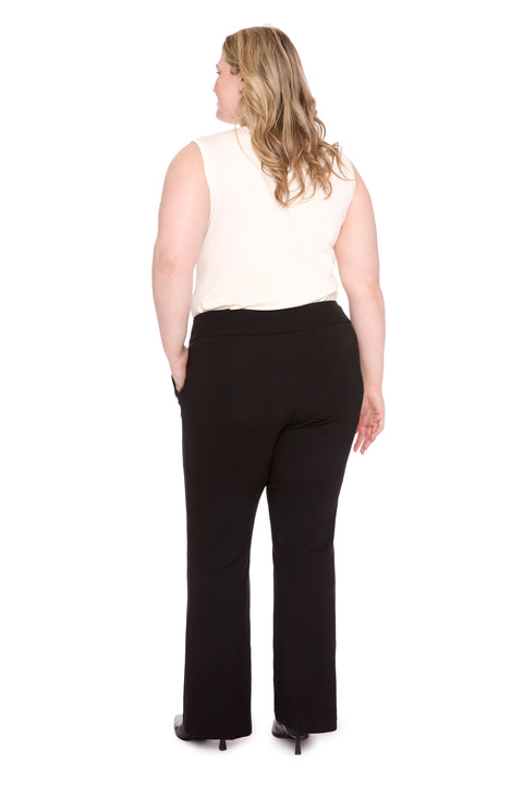 Model wearing ponte 261104_Bootcut_Black_Back, sizes 1X–3X.