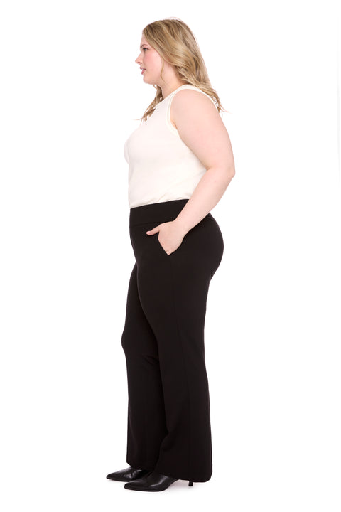 Model wearing ponte 261104_Bootcut_Black_Side, sizes 1X–3X.