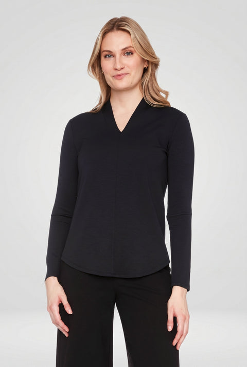 Woman wearing the Butter V-Neck Top in Black, front view.