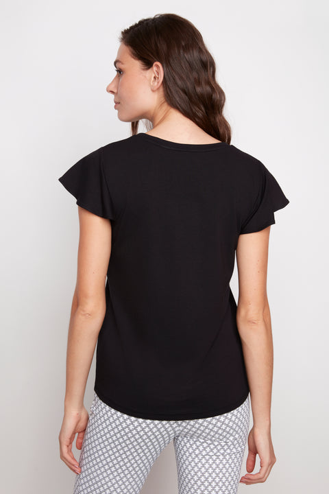 Back view of model wearing UP! Provence V-Neck Ruffle Sleeve Top in Black.