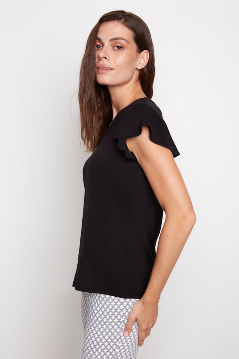 Side view of model wearing UP! Provence V-Neck Ruffle Sleeve Top in Black with ruffle sleeve detail.