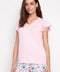 Model wearing UP! Provence V-Neck Ruffle Sleeve Top in Peony, front view.