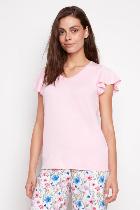 Model wearing UP! Provence V-Neck Ruffle Sleeve Top in Peony, front view.