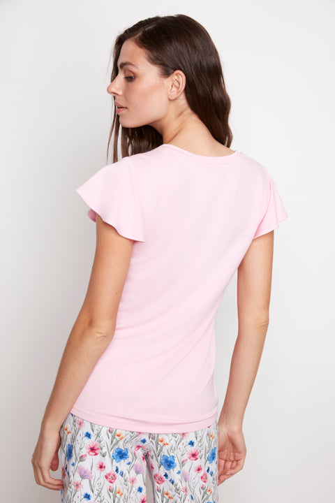 Back view of model wearing UP! Provence V-Neck Ruffle Sleeve Top in Peony.