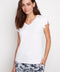 Model wearing UP! Provence V-Neck Ruffle Sleeve Top in White, front view.
