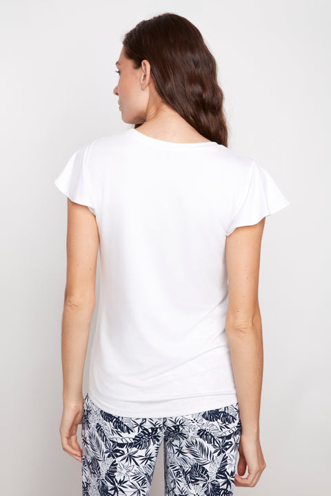 Back view of model wearing UP! Provence V-Neck Ruffle Sleeve Top in White.