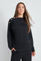 Woman wearing the Butter 3-Button Top in Black, front view.
