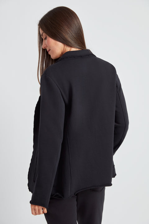 Woman wearing the French Terry Raw Edge Blazer in Black, back view.