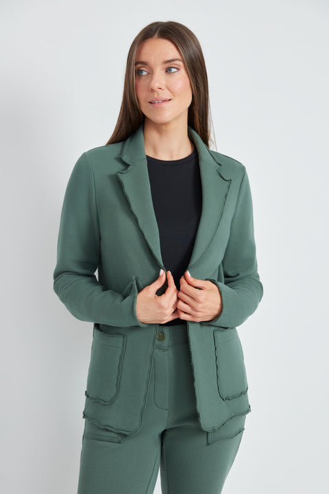 Woman wearing the French Terry Raw Edge Blazer in Ivy Green.