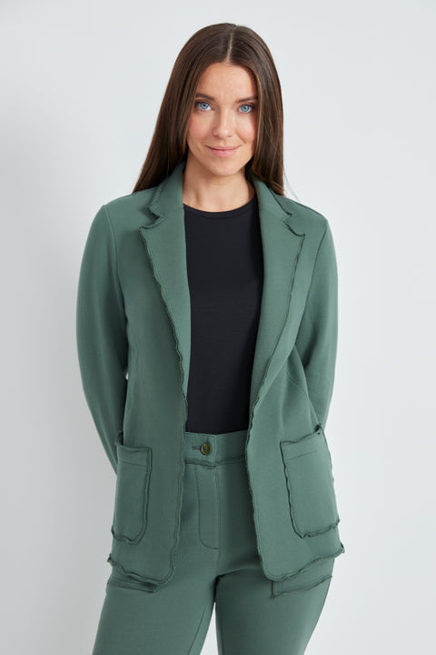 Woman wearing the French Terry Raw Edge Blazer in Ivy Green.
