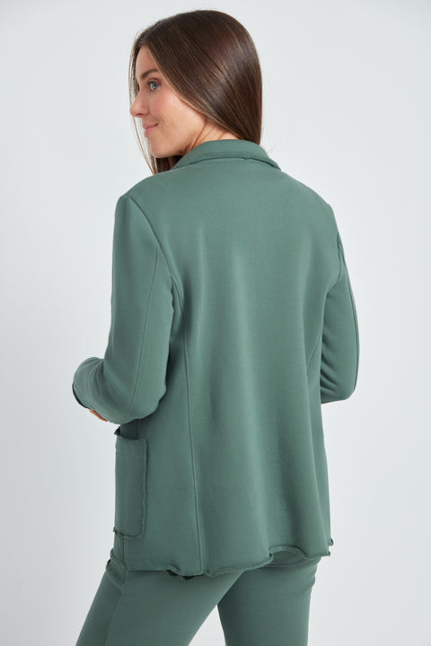 Woman wearing the French Terry Raw Edge Blazer in Ivy Green, back view.