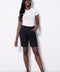 Model wearing UP! Textured Jacquard Short in Textured Black, front view.