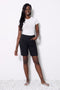 Model wearing UP! Textured Jacquard Short in Textured Black, front view.