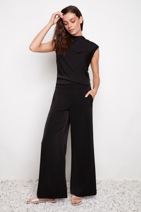 Model wearing UP! Belize Satin Wide-Leg Full-Length Pant in Black, front view.