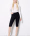 Model wearing UP! Techno Vented Bermuda Short in Black, front view.