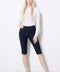 Model wearing UP! Techno Vented Bermuda Short in Navy, front view.