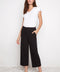 Model wearing UP! Textured Techno Wide Leg Crop Pant in Black Loom, front view.