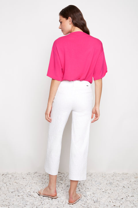 Back view of model wearing UP! Textured Techno Wide Leg Crop Pant in White Loom