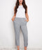 Model wearing UP! Navy Stripe Techno Button-Tab Crop Pant in Navy/White Stripe, front view.