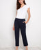 Model wearing UP! Compression Techno Button-Cuff Straight Leg Crop Pant in Navy, front view.