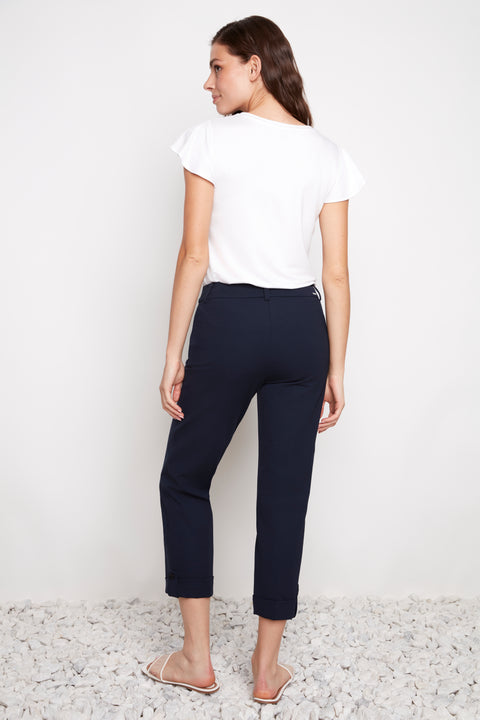 Back view of model wearing UP! Compression Techno Button-Cuff Straight Leg Crop Pant in Navy.