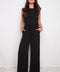 Model wearing UP! Vegan Silk Wide-Leg Full-Length Pant in Black, front view.