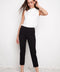 Model wearing UP! Compression Slim Front-Cuff Crop Pant in Black, front view.
