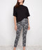 Model wearing UP! Lacey Techno Petal-Slit Ankle Pant in Black & White Lacey print, front view.