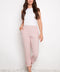 Model wearing UP! Pink Stripe Techno Button-Tab Crop Pant in Pink/White Stripe, front view.